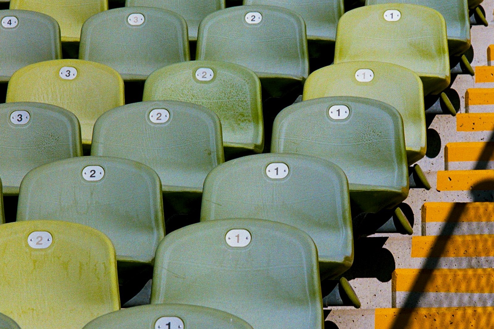 Rows of empty numbered stadium seats